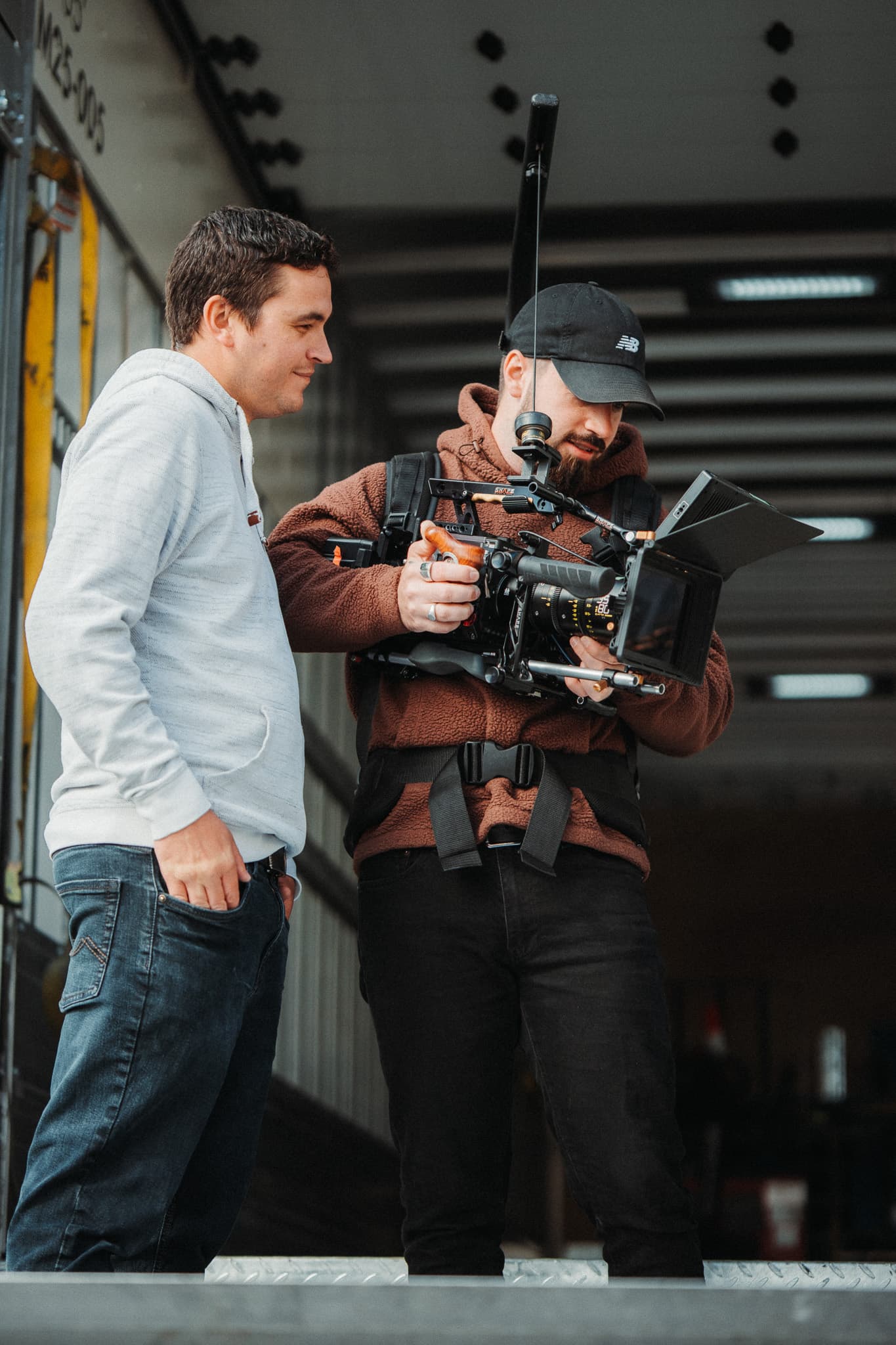 Two crew members framing a shot